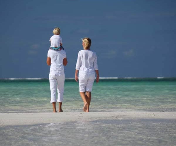 Coral Lodge 014 Family walk on the Beach